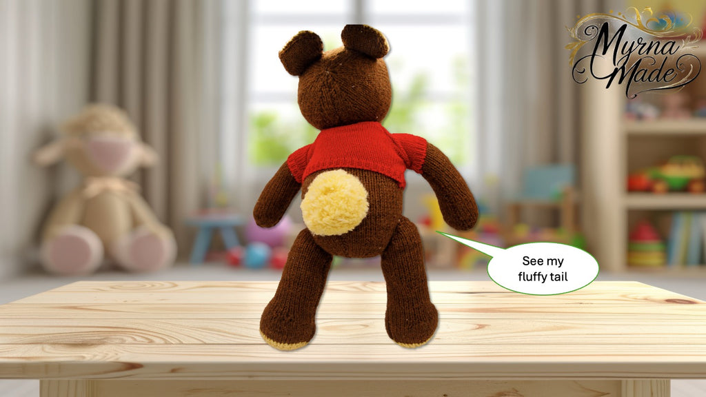 Brown teddy bear with a red sweater on a wooden table, with a blurred background of toys and furniture.