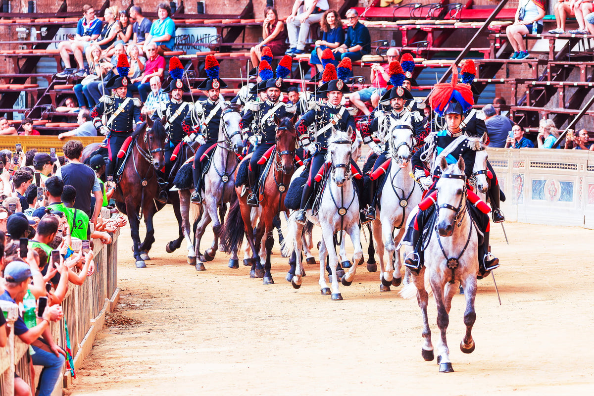 Carabinieri cavalry in ceremonial uniform at the Palio di Siena, led by a woman for the first time in history