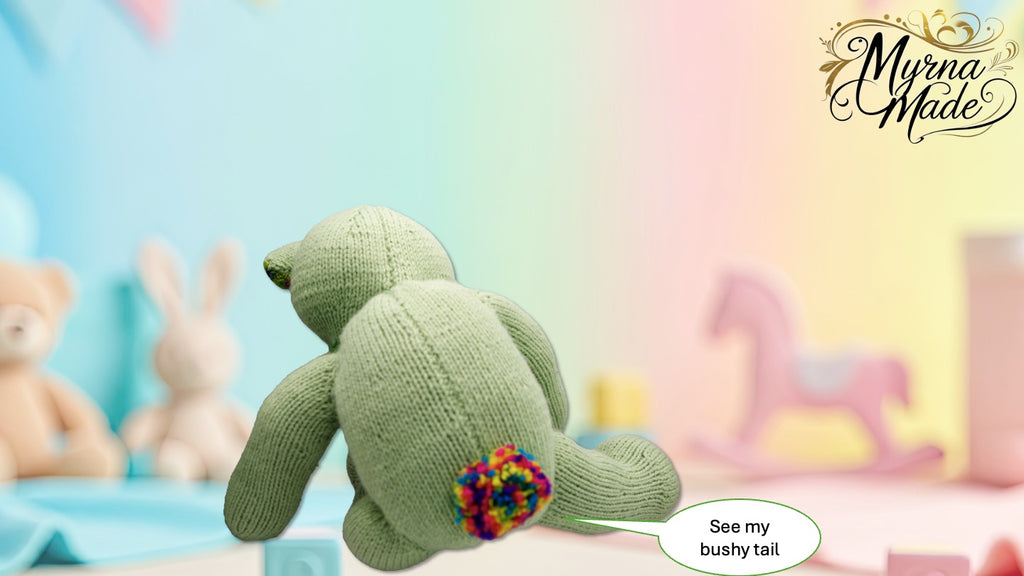 Knitted teddy bear with colorful tail on a pastel background, featuring 'Myrna Made' branding.