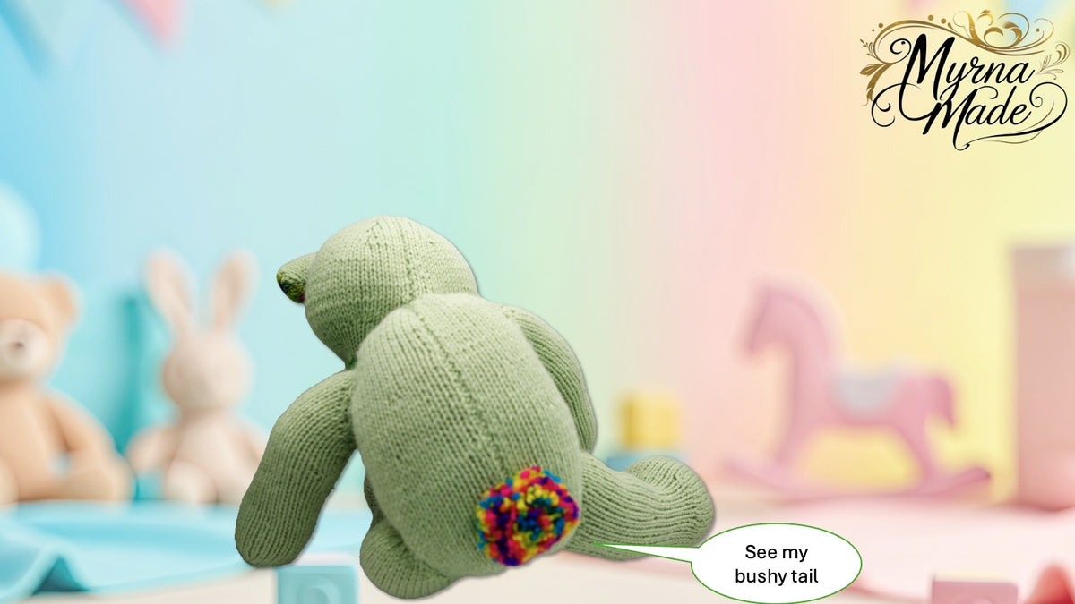 Knitted teddy bear with colorful tail on a pastel background, featuring 'Myrna Made' branding.