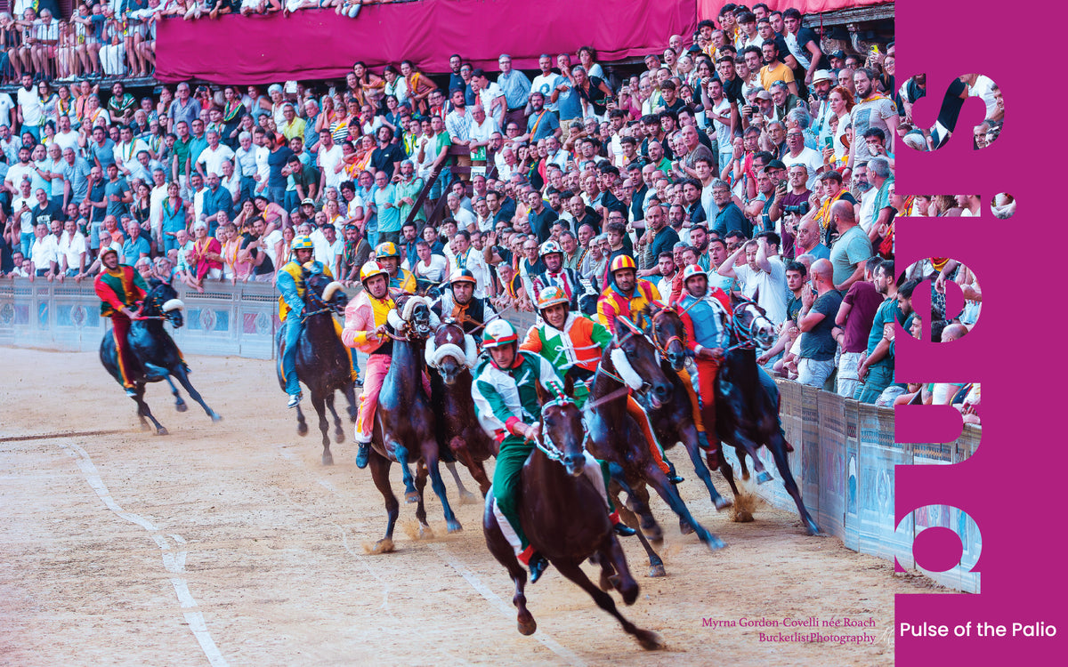 Jockeys in colourful contrada silks racing on horseback around the Campo at the Palio di Siena with packed grandstands
